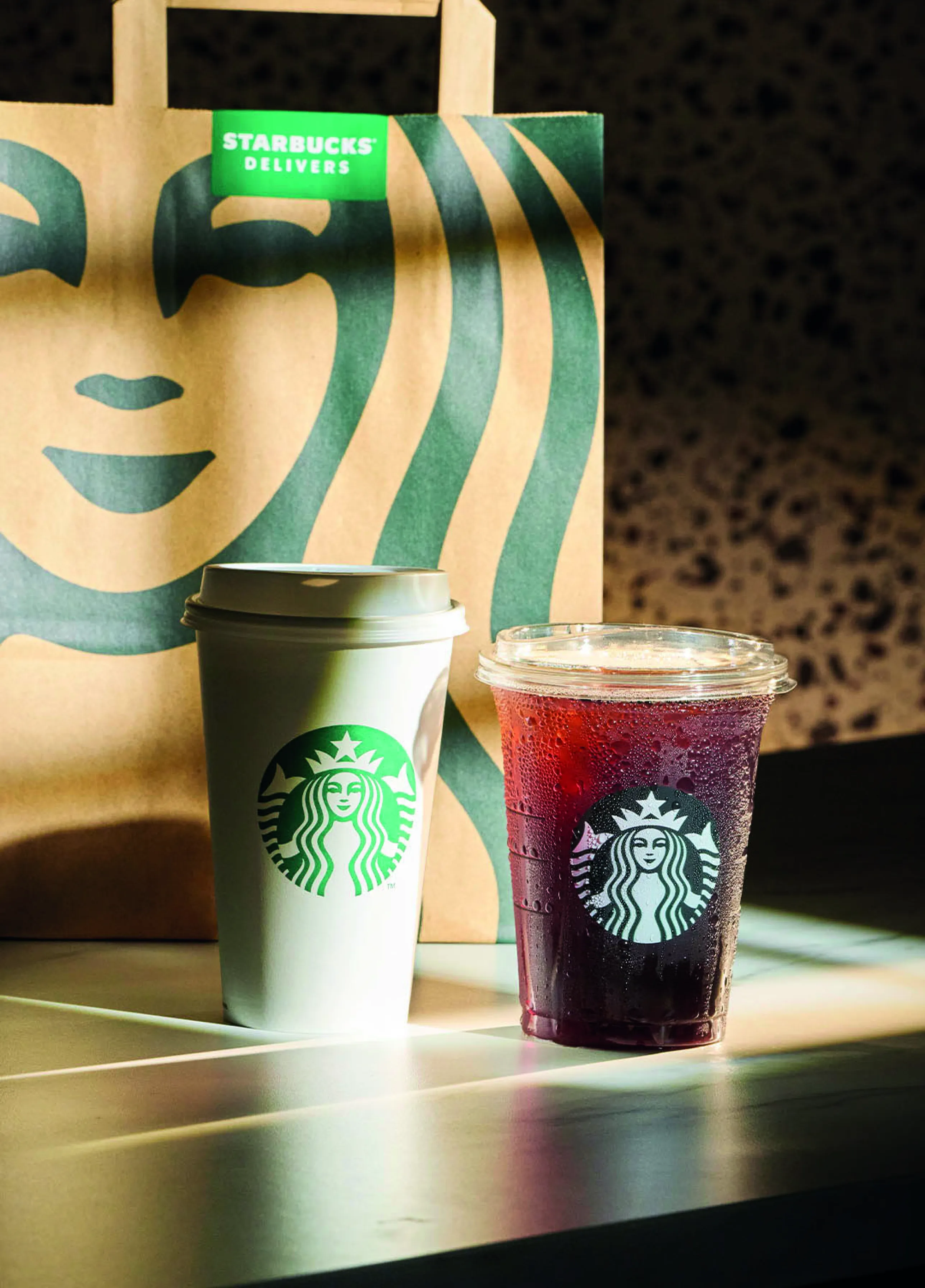 Delivery Bag with two drinks on a table 