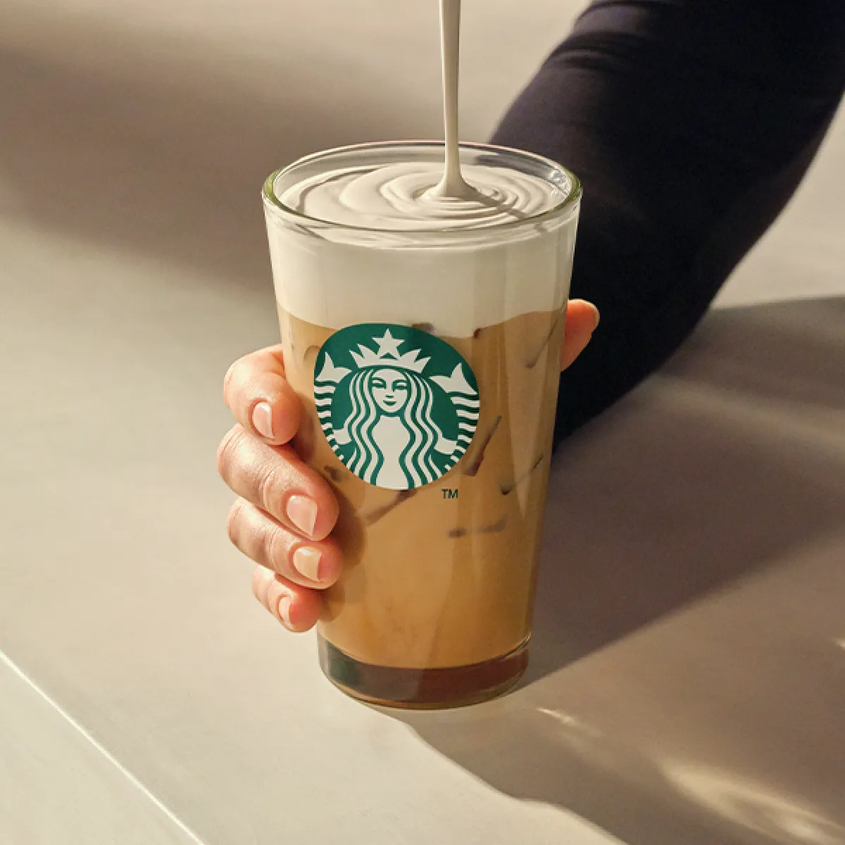 Iced Caramel Protein Latte being poured