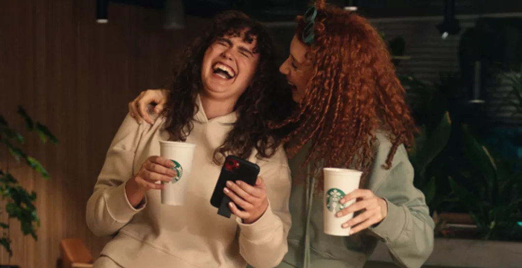 Two girls enjoying oat lattes 